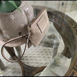 Coach beautiful poppy metallic wristlet.  Approximate 6 1/2 x 4 size.